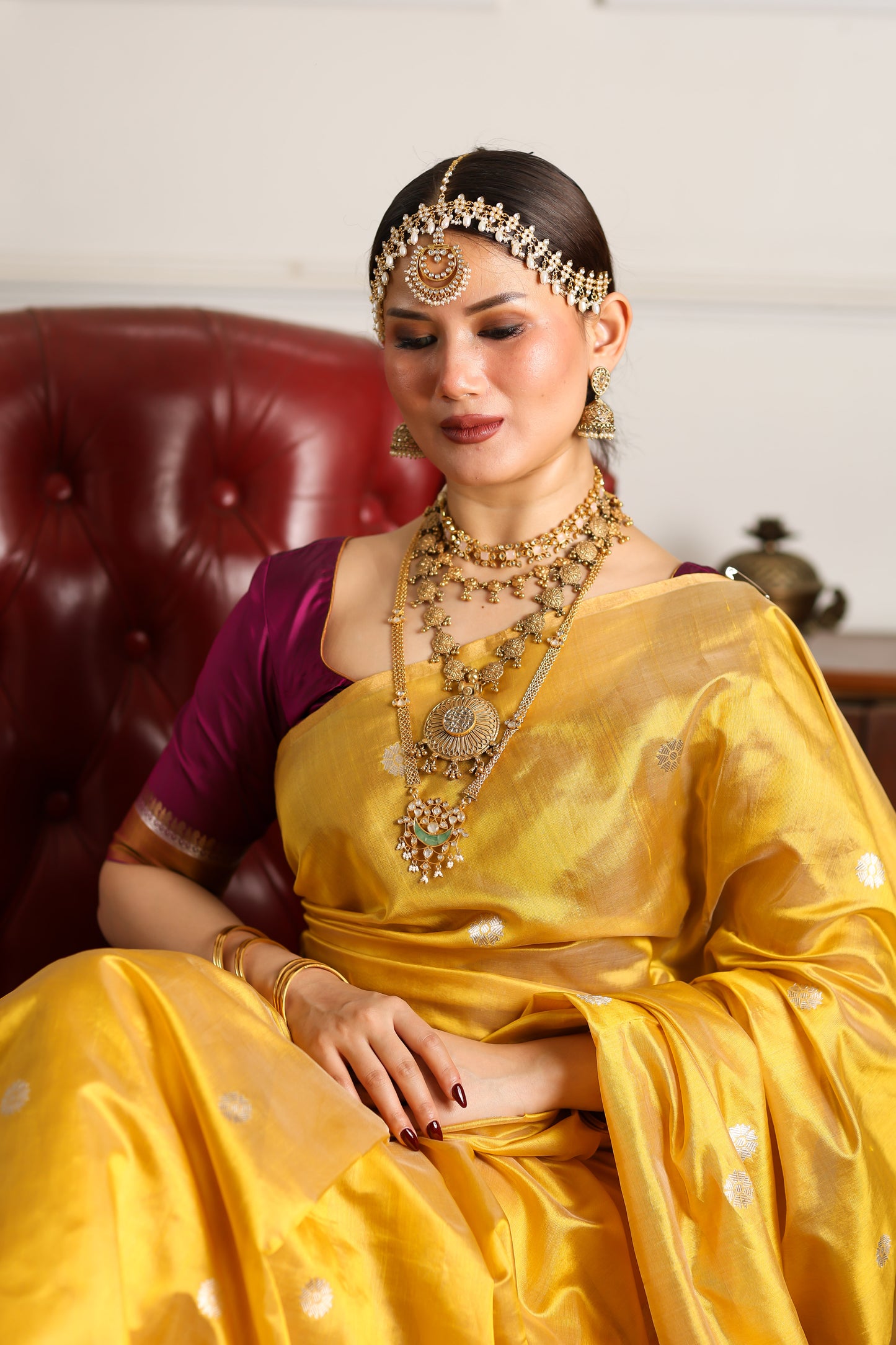 Yellow pure chanderi silk handwoven saree with thin zari border and meenakari buttis, front close up